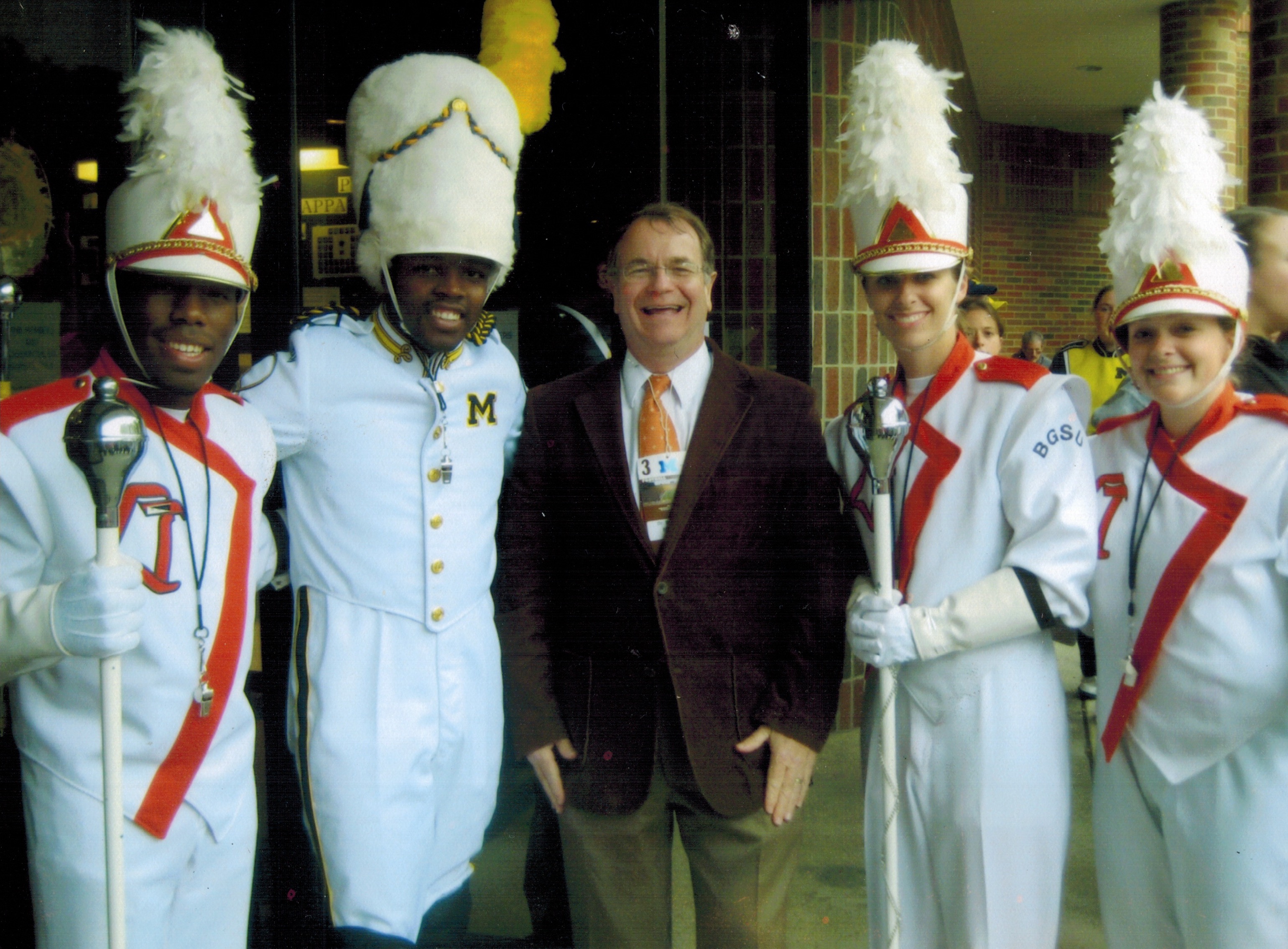  Dr. Moss with FMB Drum Majors and Univ. of Michigan Drum Major.  