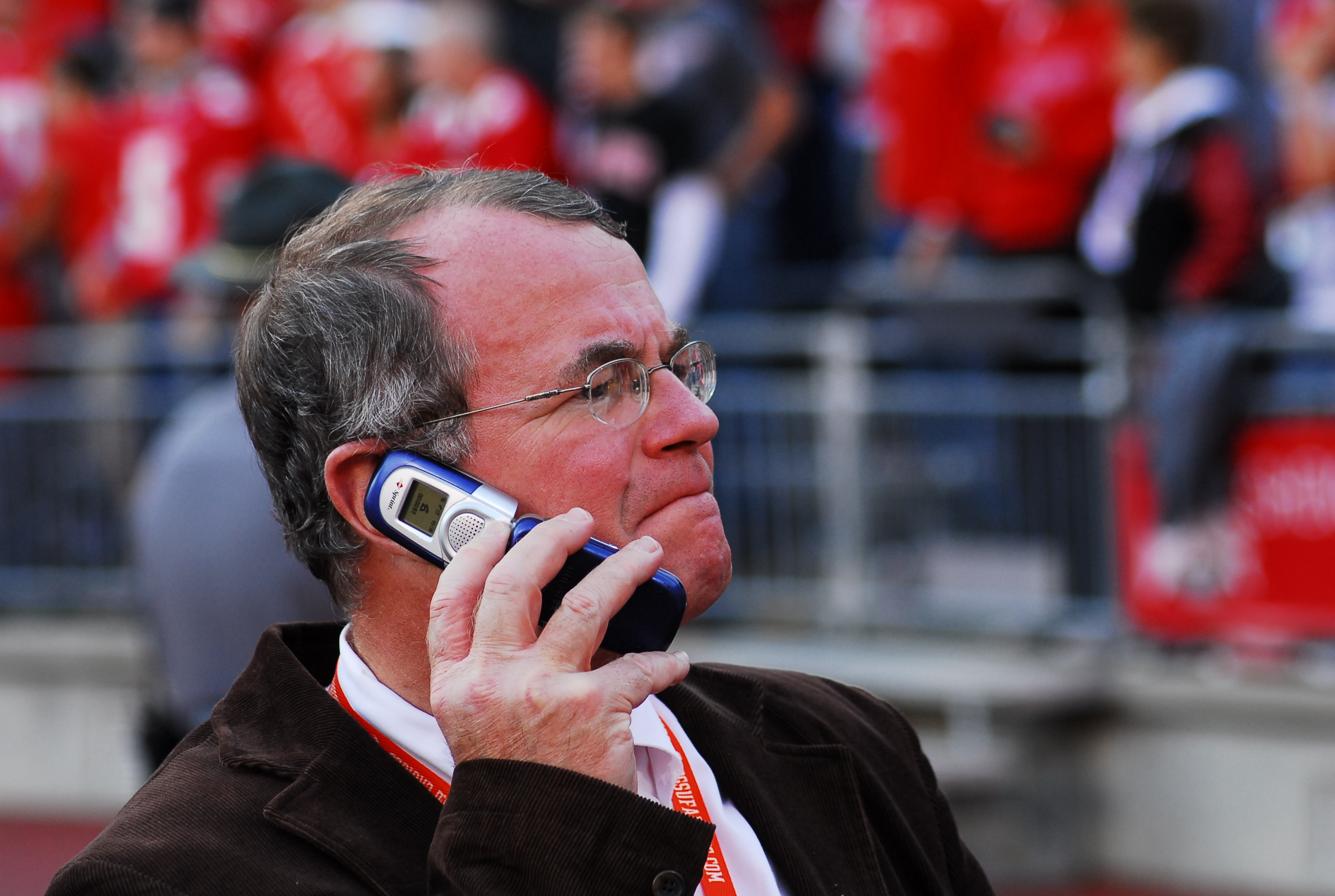  Calling in a play? Dr. Moss on his flip phone (fall, 2004) (photo: Bill Hayward) 